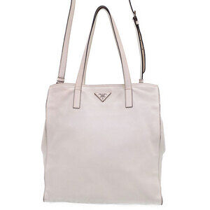 Prada tote bag refined leather features subtle triangular logo plaque White